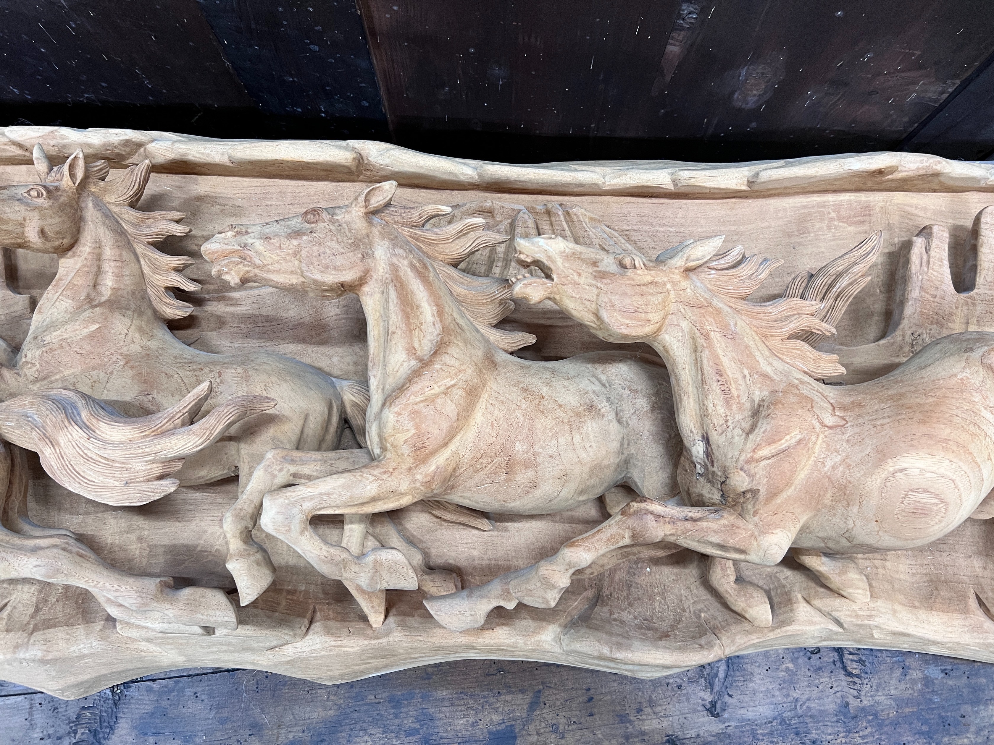 An unusual, probably American, carved wood panorama of eight galloping horses, width 200cm, height 46cm *Please note the sale commences at 9am.